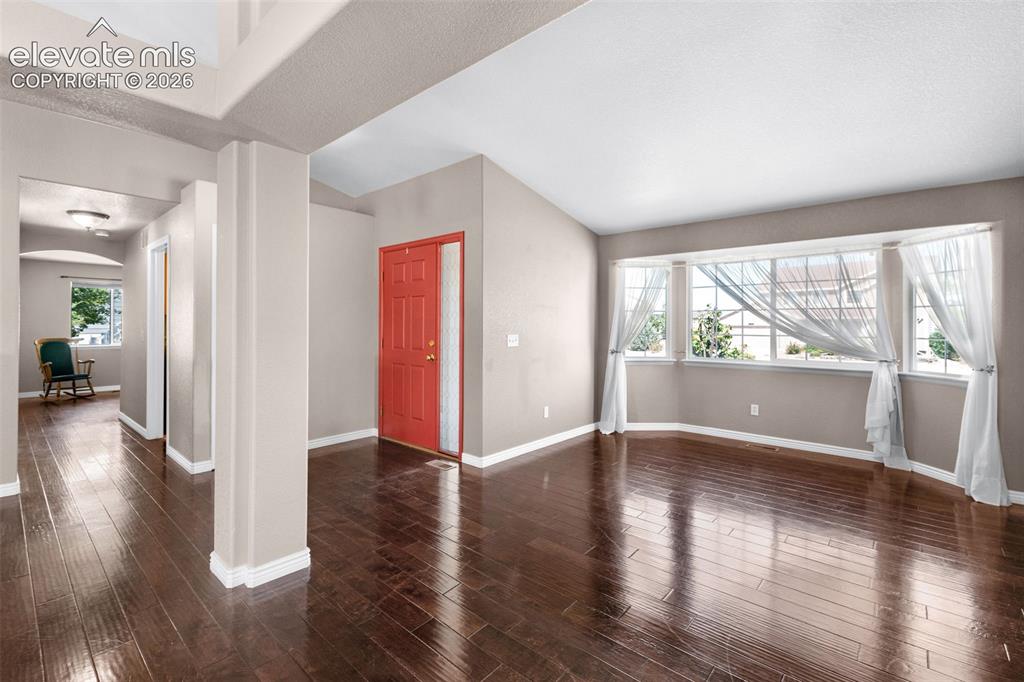 7840 Midnight Road Peyton, CO 80831 - Photo 9 of 48 Vaulted ceilings, gleaming wood floors, multii windows, and architectural touches show off this beautiful home