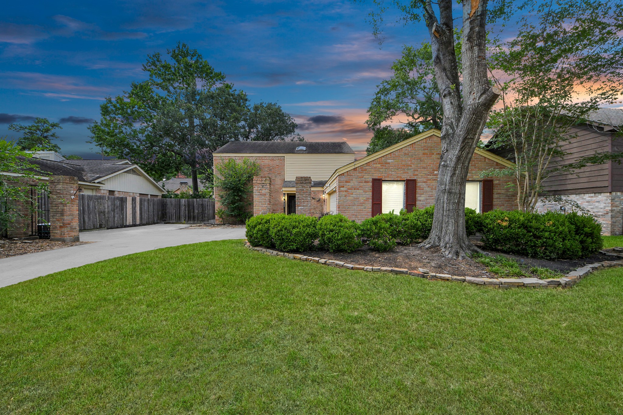 a front view of house with yard and green space