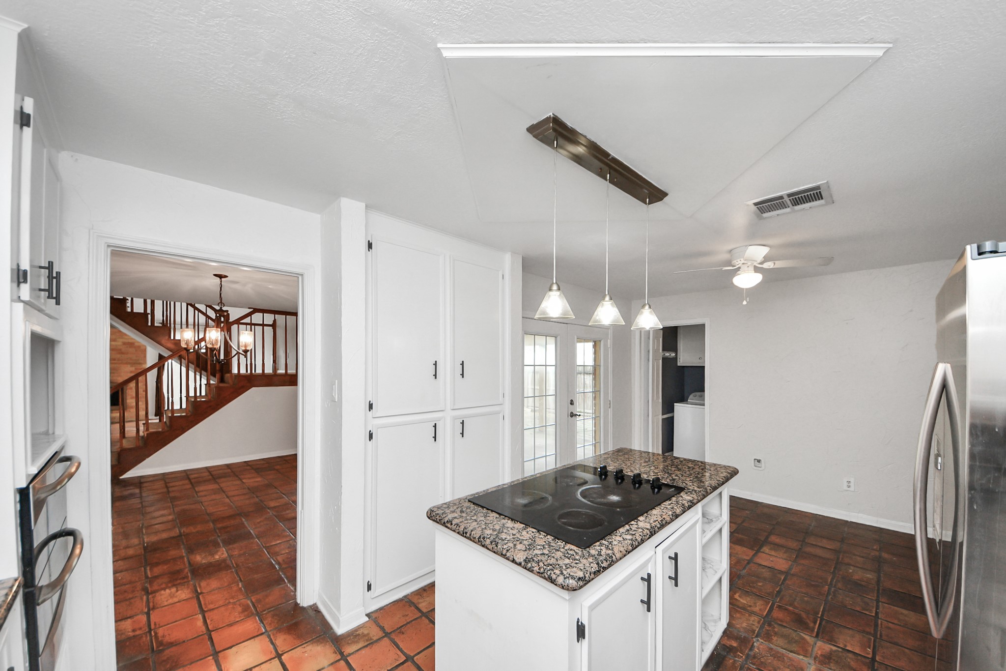 6706 Trebeck Lane Spring, TX 77379 - Photo 14 of 46 a kitchen with stainless steel appliances granite countertop a refrigerator a sink and a stove