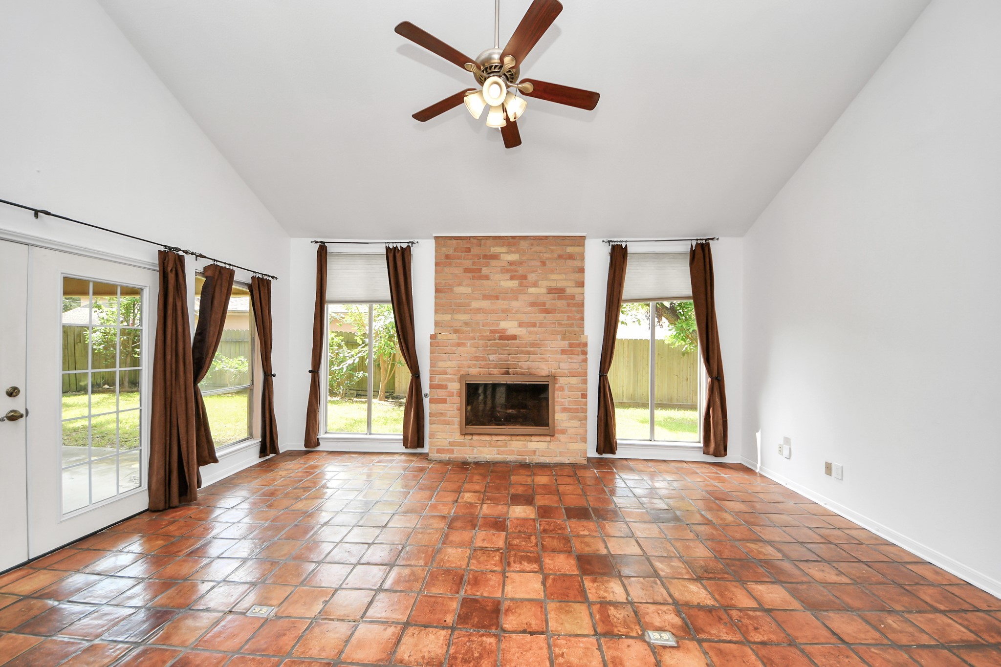 6706 Trebeck Lane Spring, TX 77379 - Photo 22 of 46 a view of an empty room with window and a kitchen view