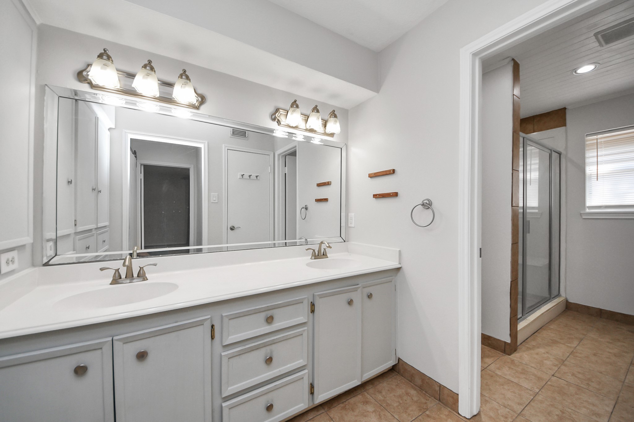 6706 Trebeck Lane Spring, TX 77379 - Photo 24 of 46 a bathroom with a double vanity sink mirror and