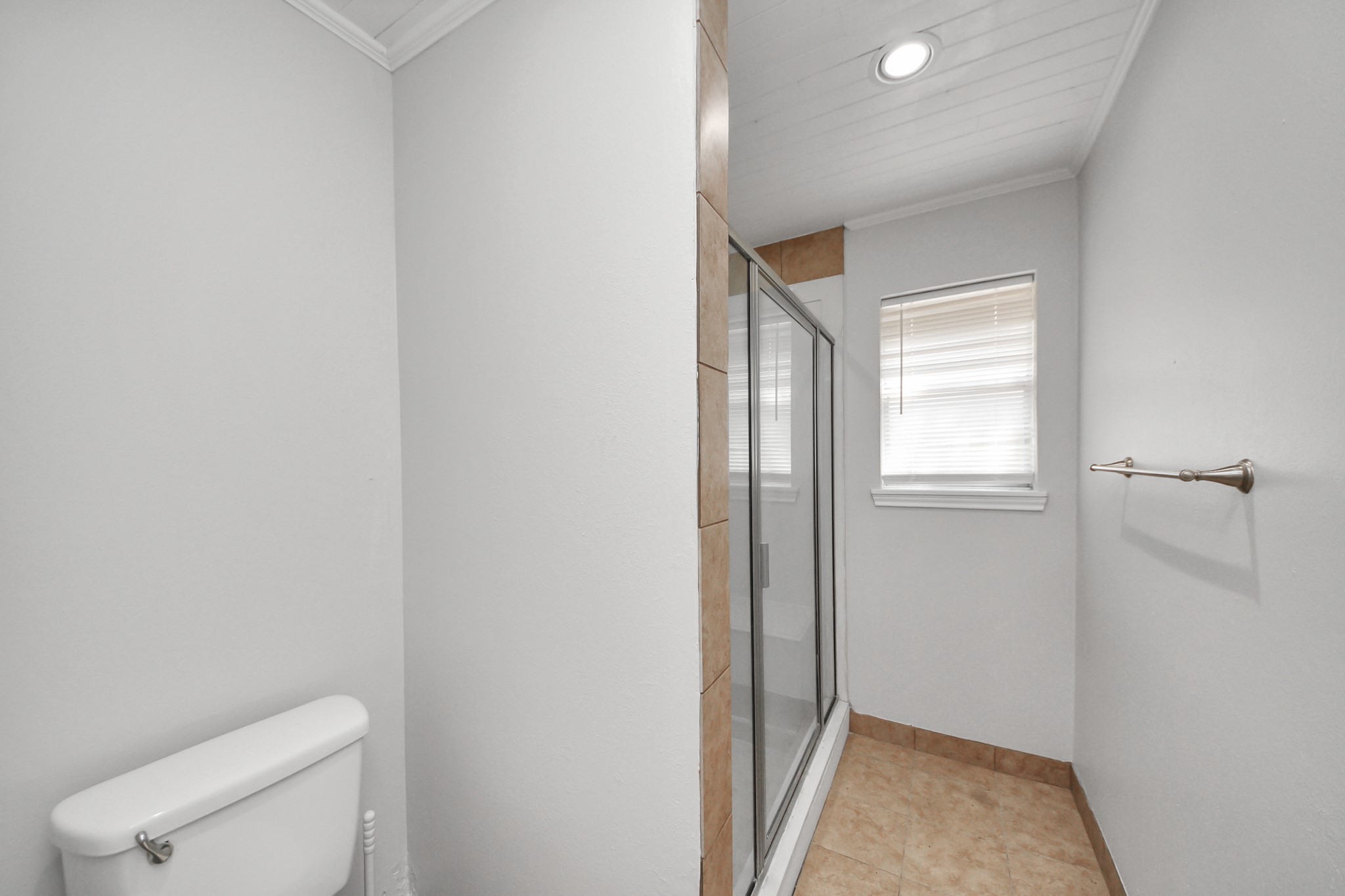 6706 Trebeck Lane Spring, TX 77379 - Photo 26 of 46 a bathroom with a toilet and a shower