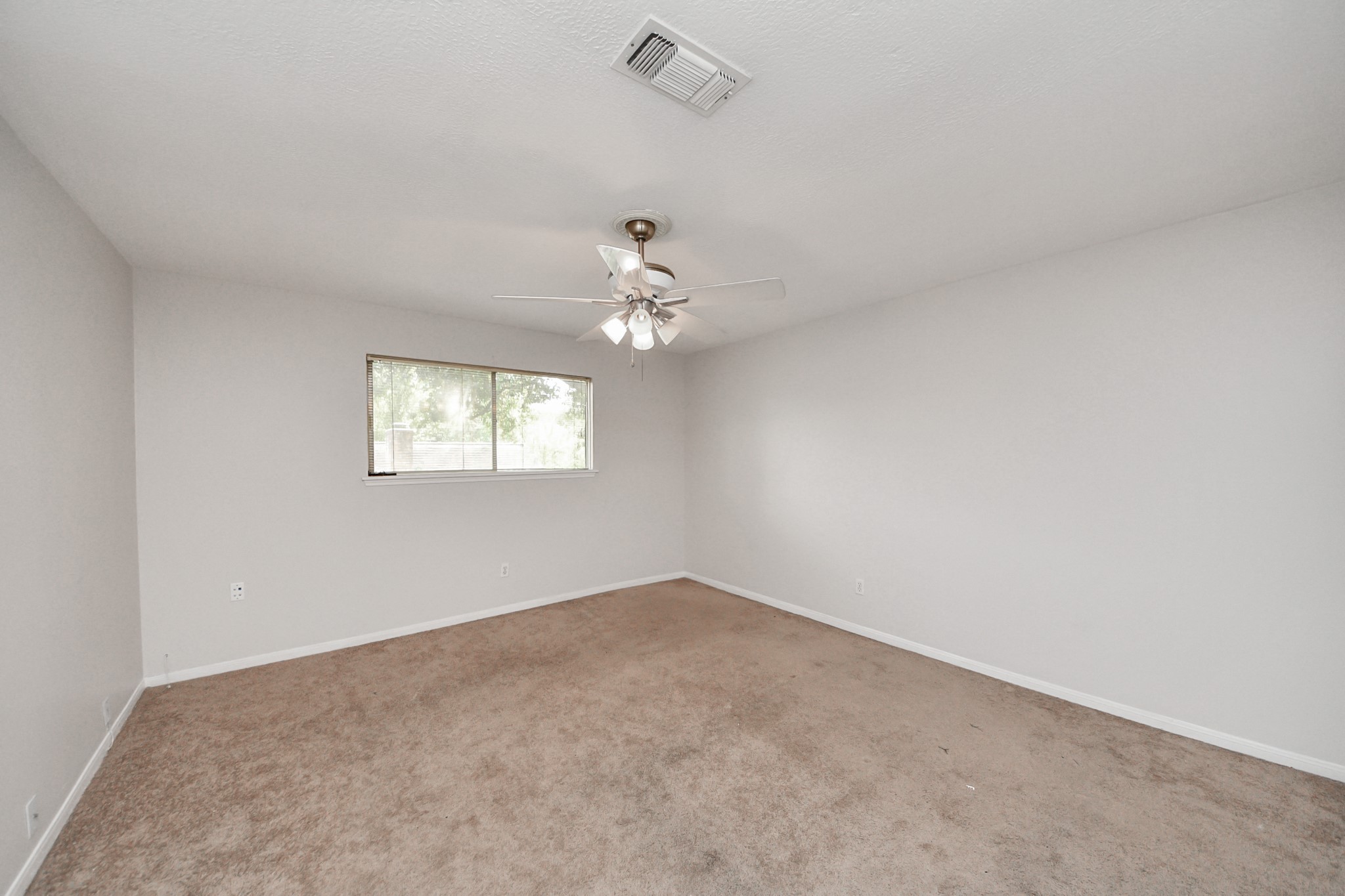 6706 Trebeck Lane Spring, TX 77379 - Photo 38 of 46 a view of a chandelier fan and window in a room