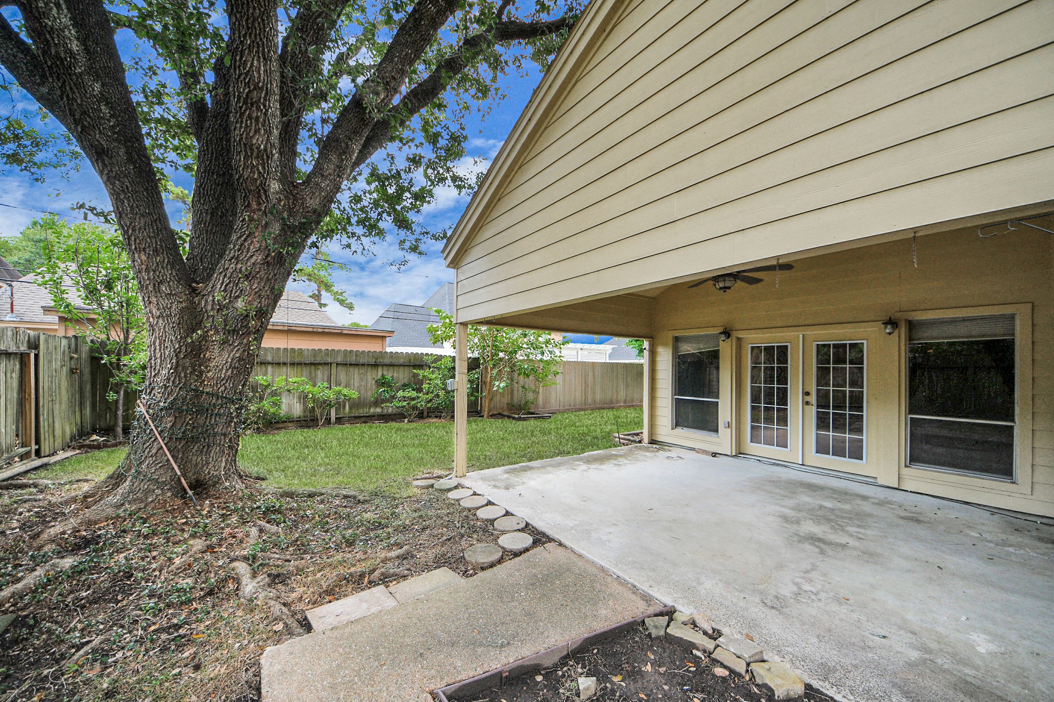 6706 Trebeck Lane Spring, TX 77379 - Photo 40 of 46 a view of a house with backyard and a tree