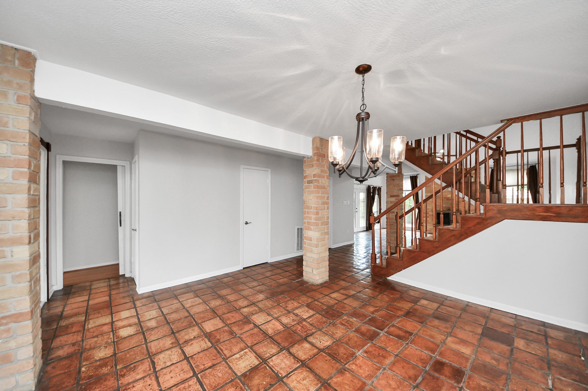 6706 Trebeck Lane Spring, TX 77379 - Photo 7 of 46 a view of an entryway wooden floor and chandelier
