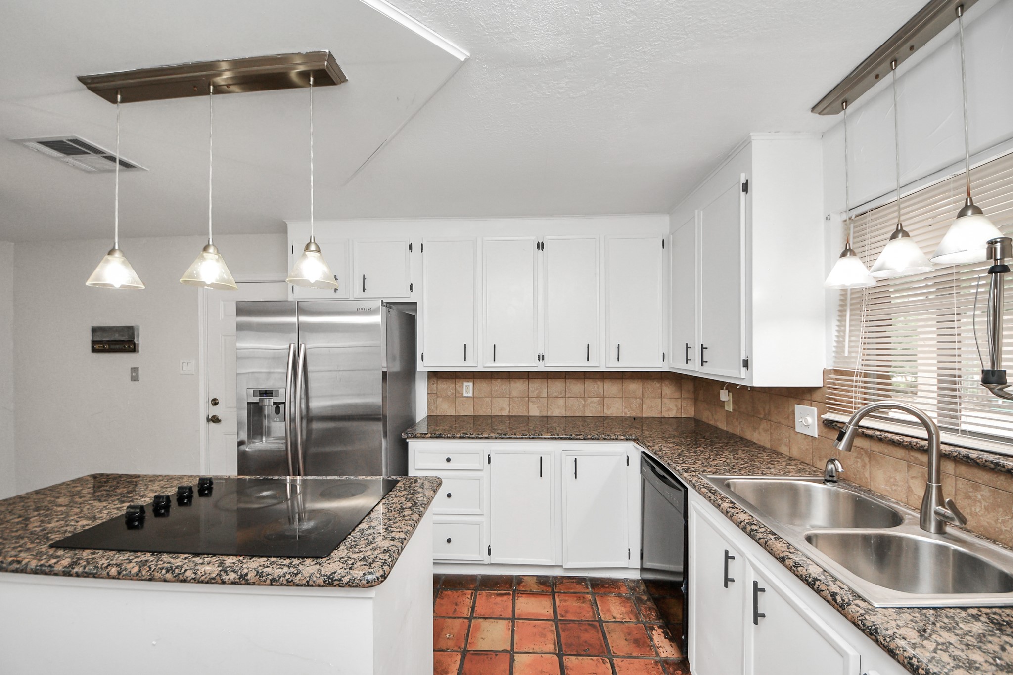 6706 Trebeck Lane Spring, TX 77379 - Photo 9 of 46 a kitchen with granite countertop a sink a counter top space appliances and cabinets