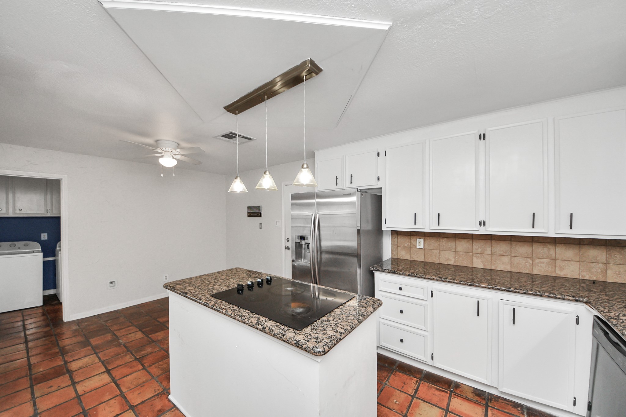6706 Trebeck Lane Spring, TX 77379 - Photo 10 of 46 a kitchen with granite countertop a sink a stove and cabinets
