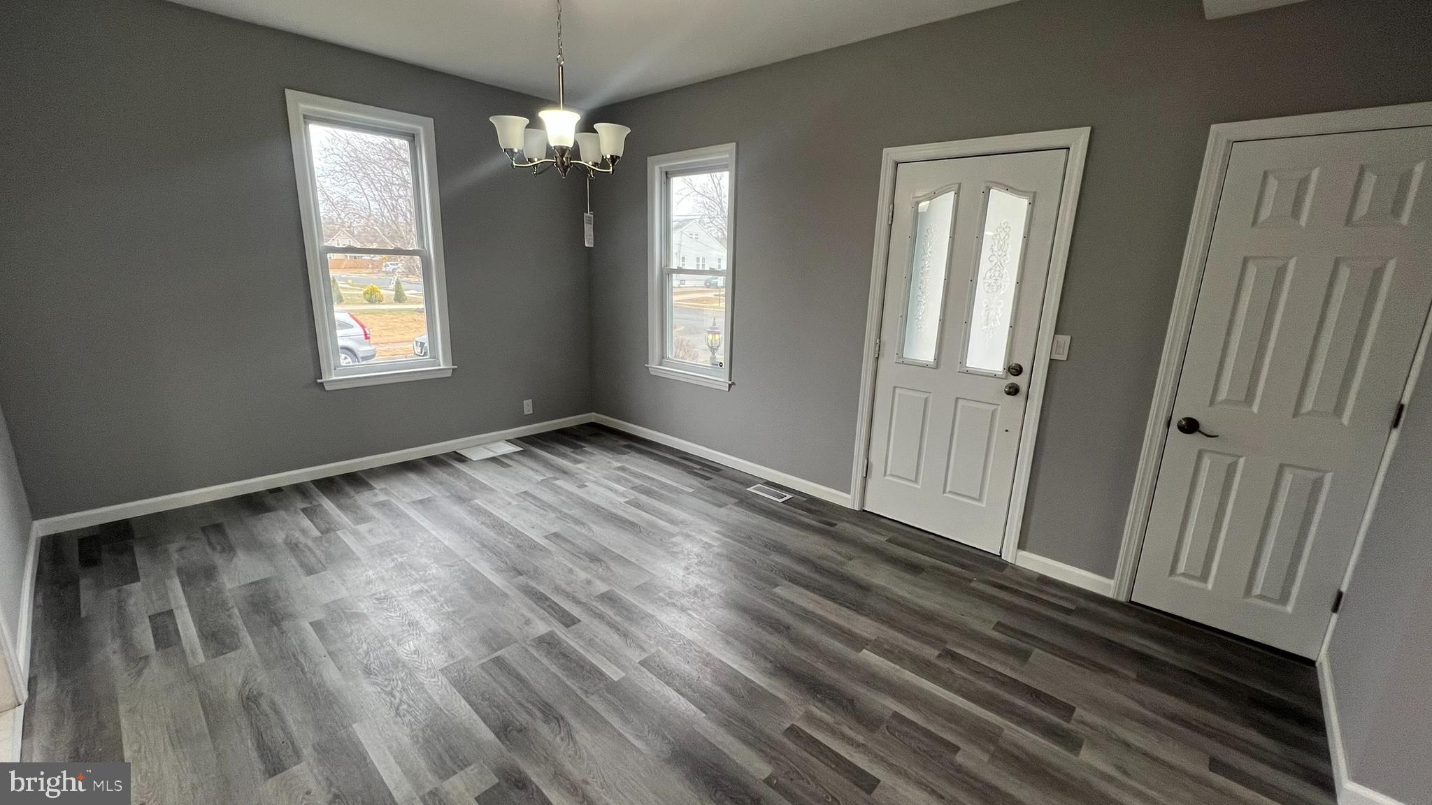 434 East Maple Avenue Lindenwold, NJ 08021 - Photo 12 of 36 a view of an empty room with wooden floor and a window