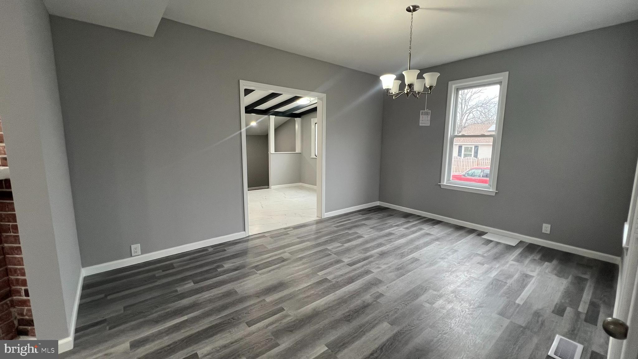 434 East Maple Avenue Lindenwold, NJ 08021 - Photo 13 of 36 a view of an empty room with window and wooden floor