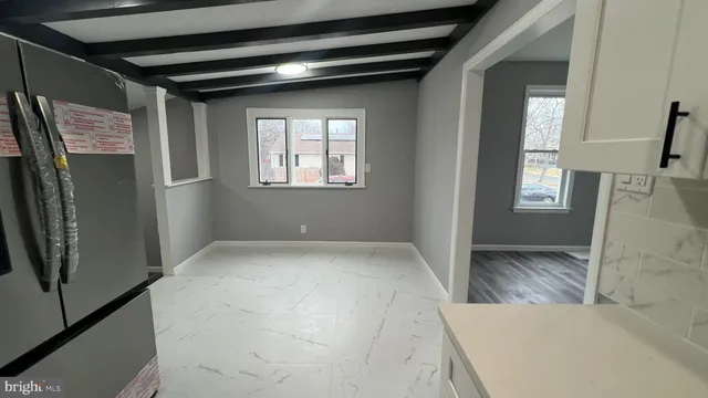 a view of an empty room and window