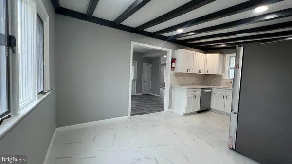 a bathroom with a shower and a sink