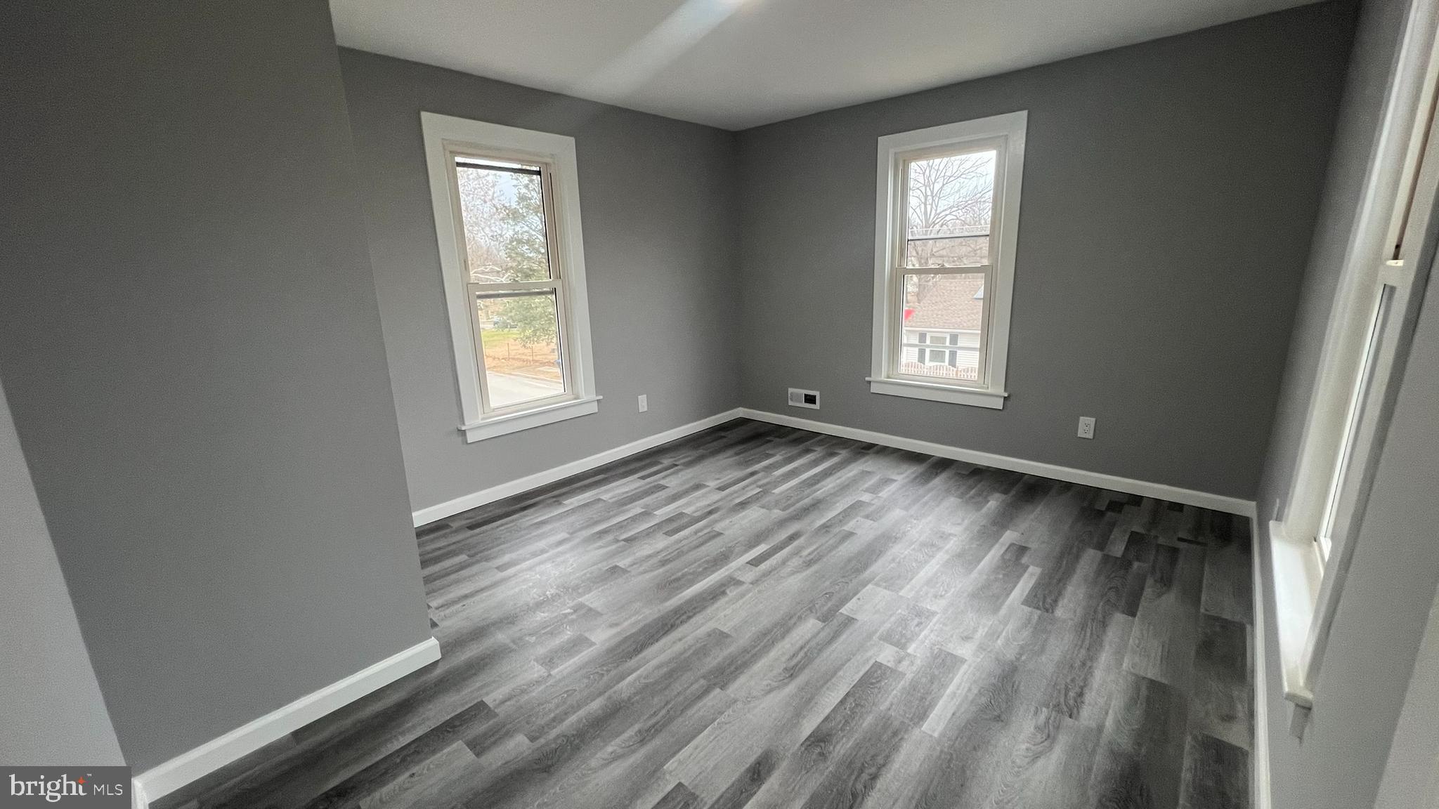 434 East Maple Avenue Lindenwold, NJ 08021 - Photo 27 of 36 a view of an empty room with wooden floor and window