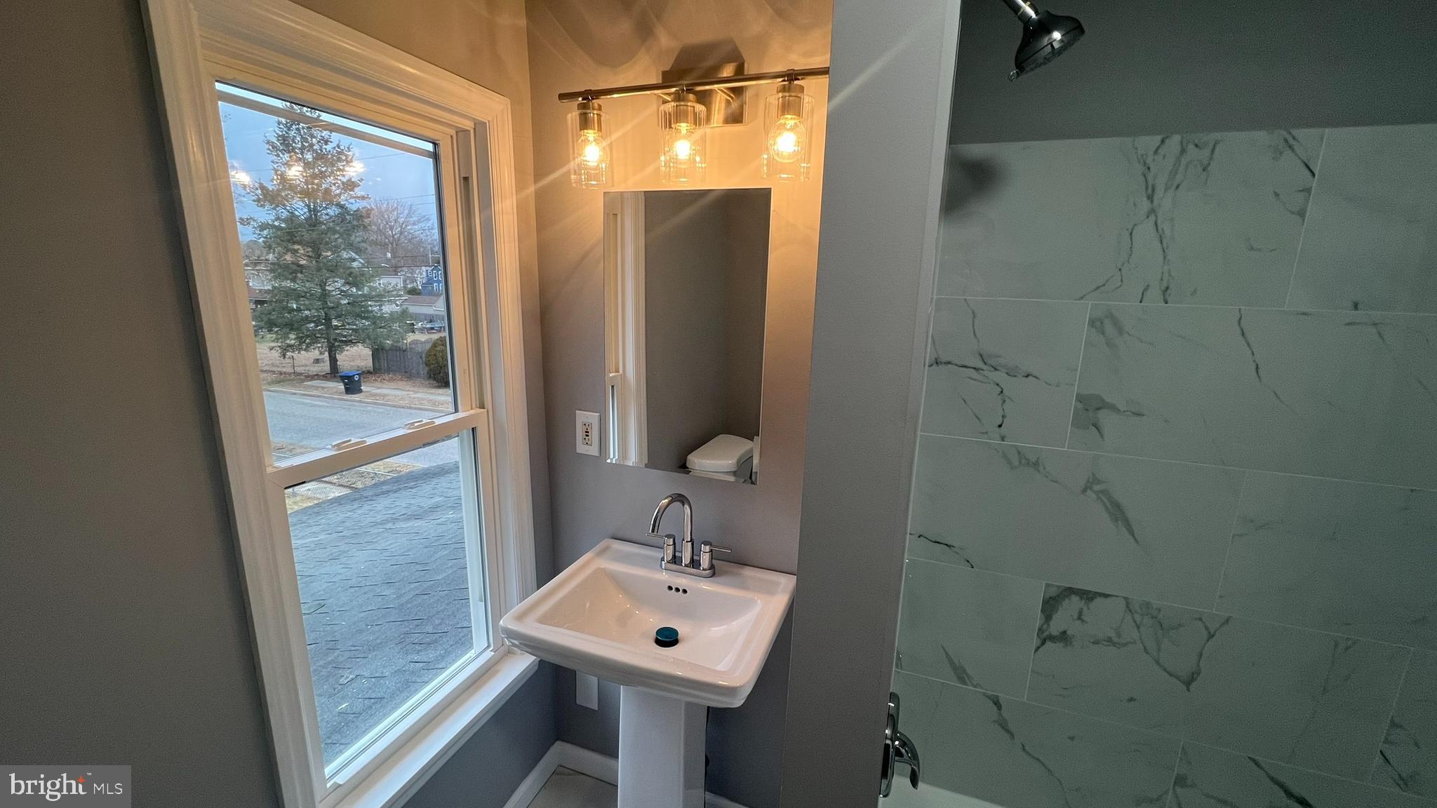 434 East Maple Avenue Lindenwold, NJ 08021 - Photo 30 of 36 a bathroom with a sink toilet and shower