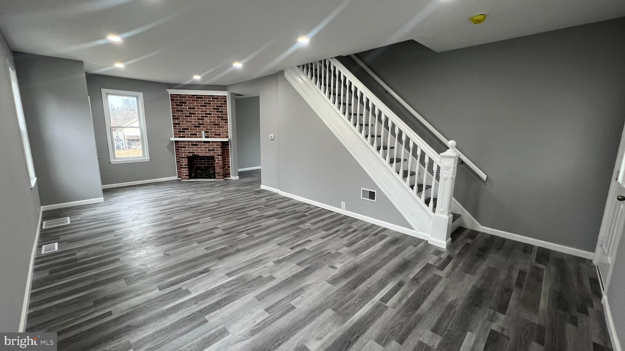 434 East Maple Avenue Lindenwold, NJ 08021 - Photo 8 of 36 a view of a livingroom with wooden floor and staircase
