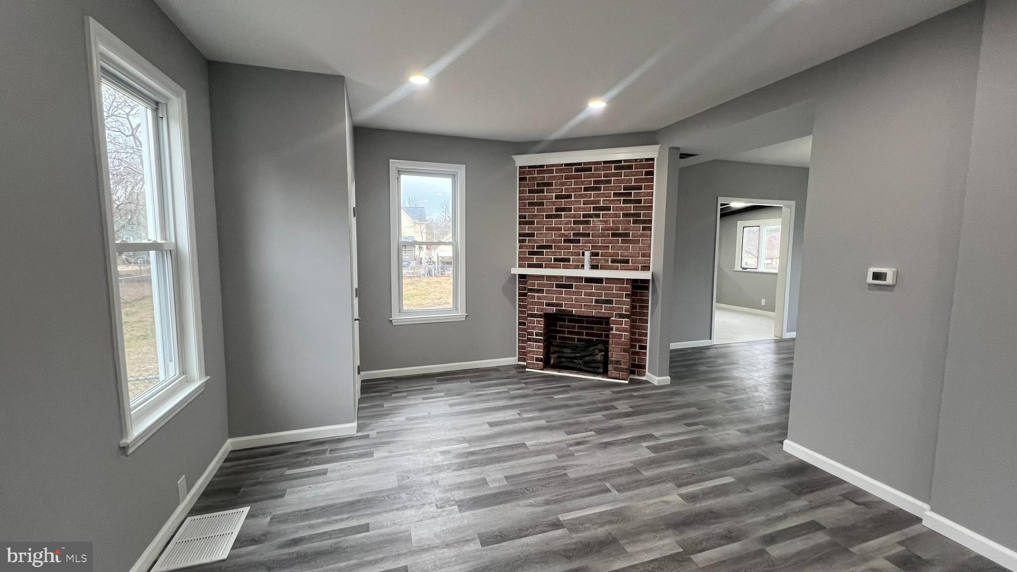 434 East Maple Avenue Lindenwold, NJ 08021 - Photo 9 of 36 an empty room with wooden floor cabinet and windows