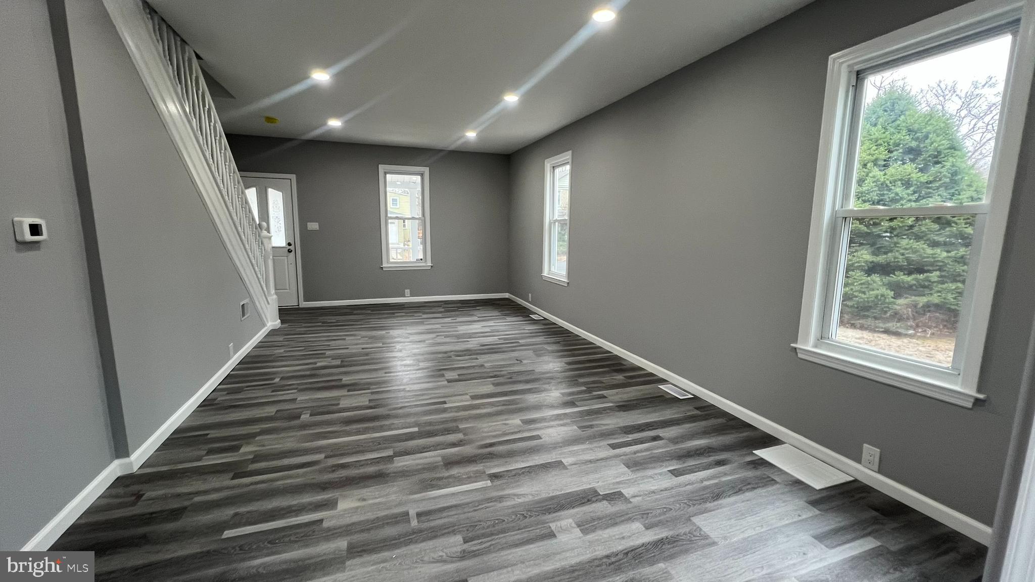 434 East Maple Avenue Lindenwold, NJ 08021 - Photo 10 of 36 an empty room with wooden floor and windows