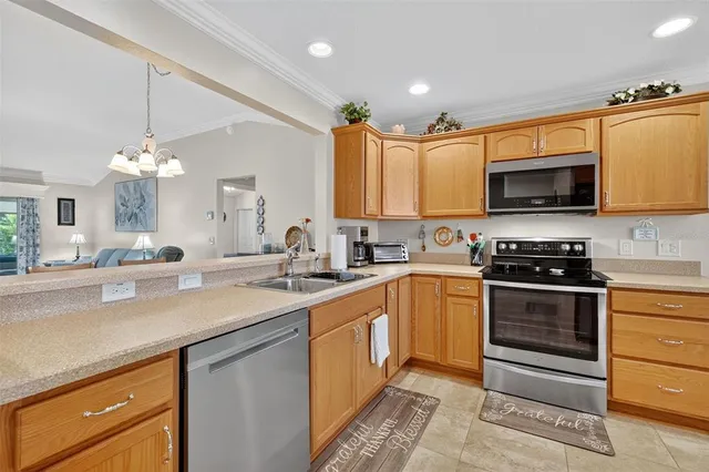a kitchen with a sink stove and microwave