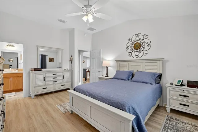 a bedroom with a bed and a view of bedroom