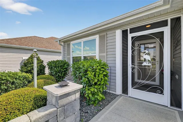 a view of a door and chair in front of a house