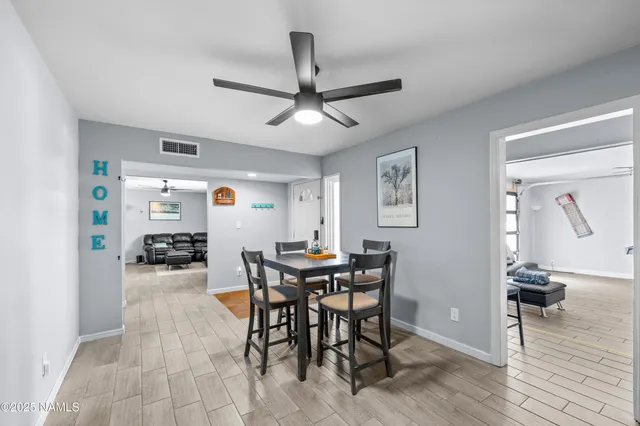 a kitchen with stainless steel appliances granite countertop a sink dishwasher stove refrigerator and cabinets