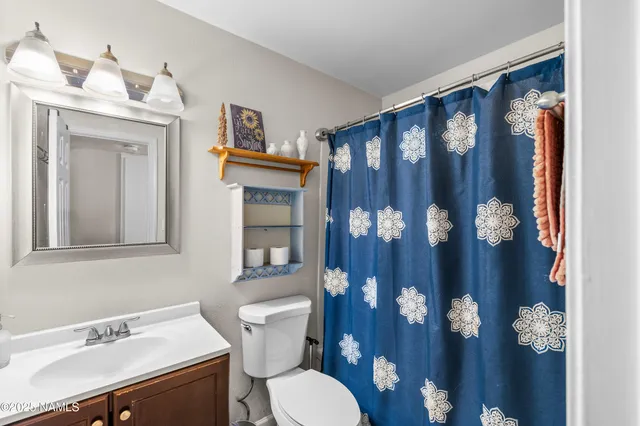 a bedroom with a bed couch and a window