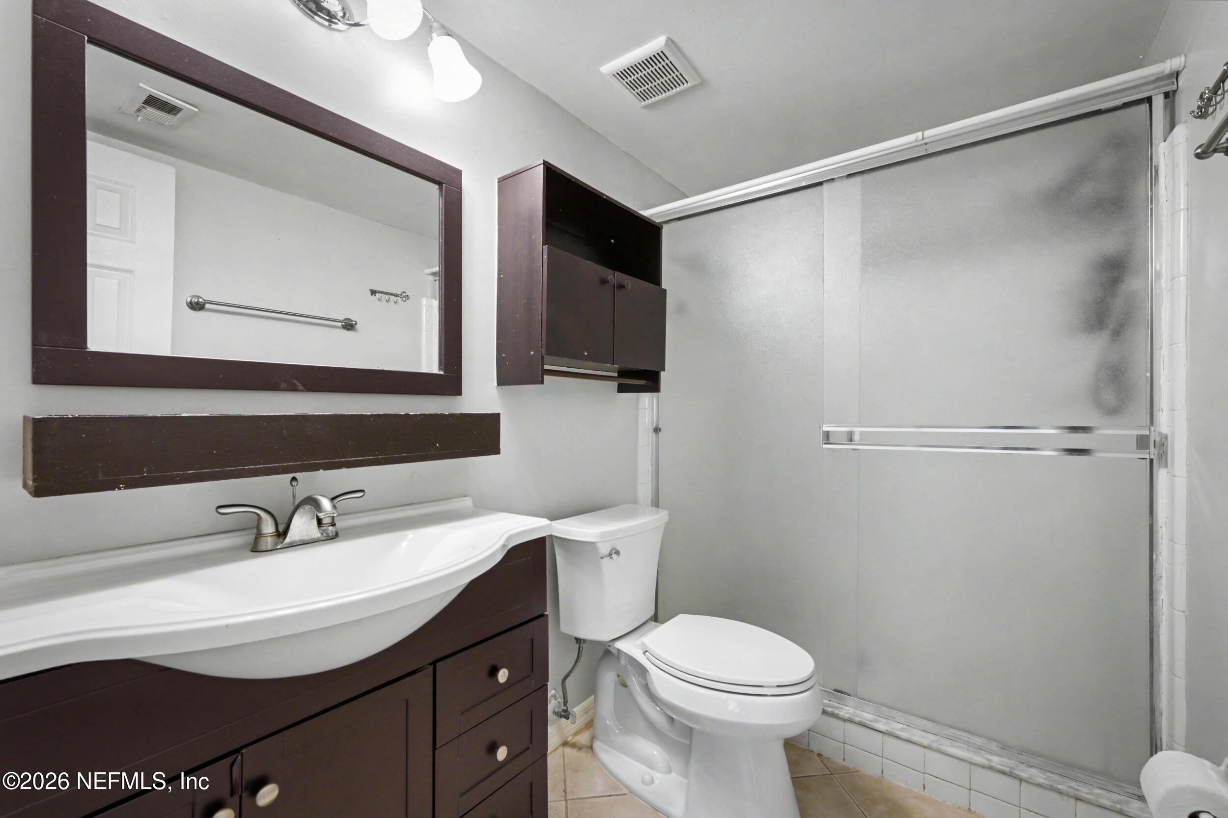 2811 Sea Hawk Drive Ponte Vedra Beach, FL 32082 - Photo 18 of 24 a bathroom with a sink a toilet and a mirror