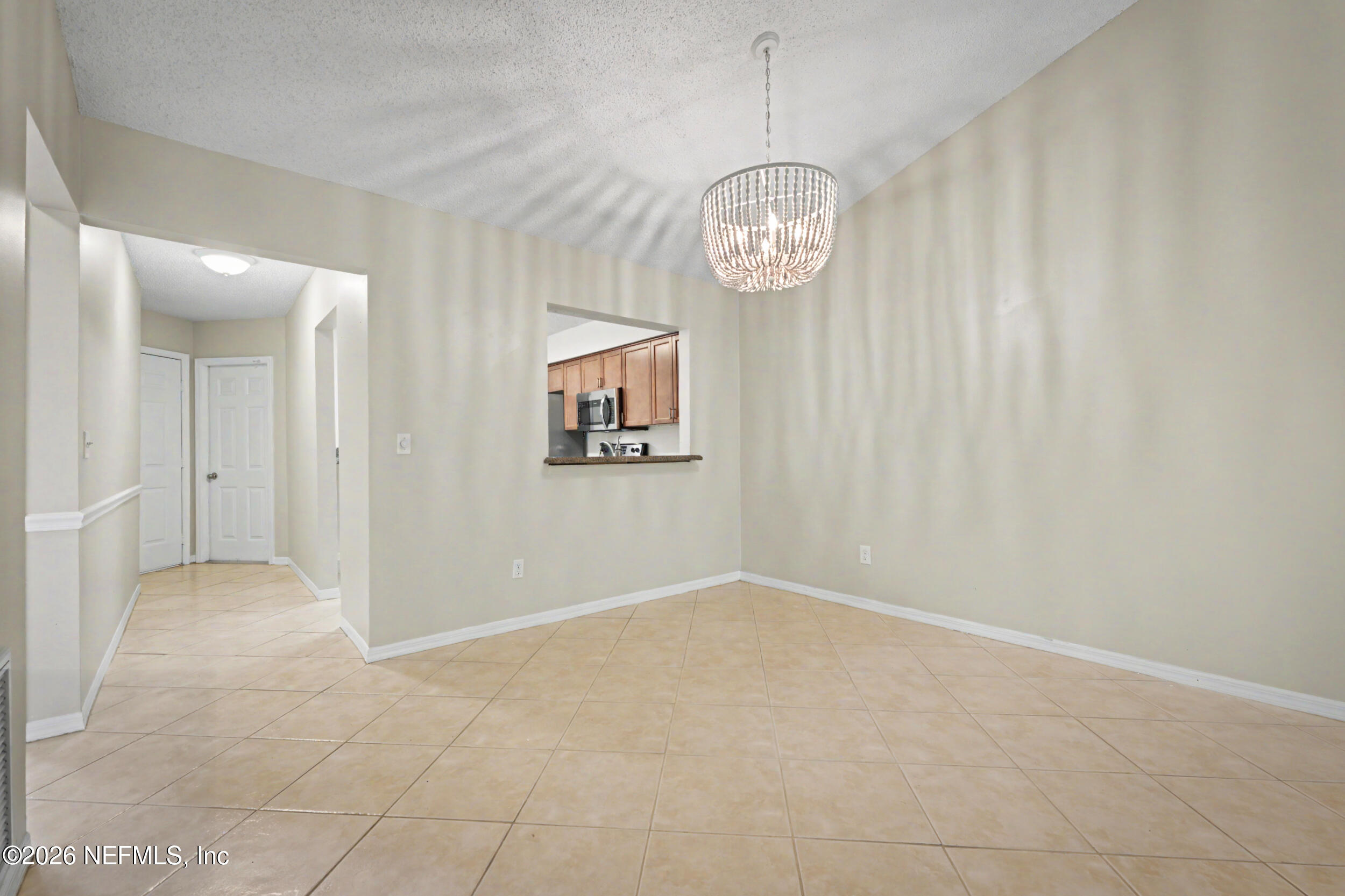 2811 Sea Hawk Drive Ponte Vedra Beach, FL 32082 - Photo 7 of 24 an empty room with wooden floor and windows
