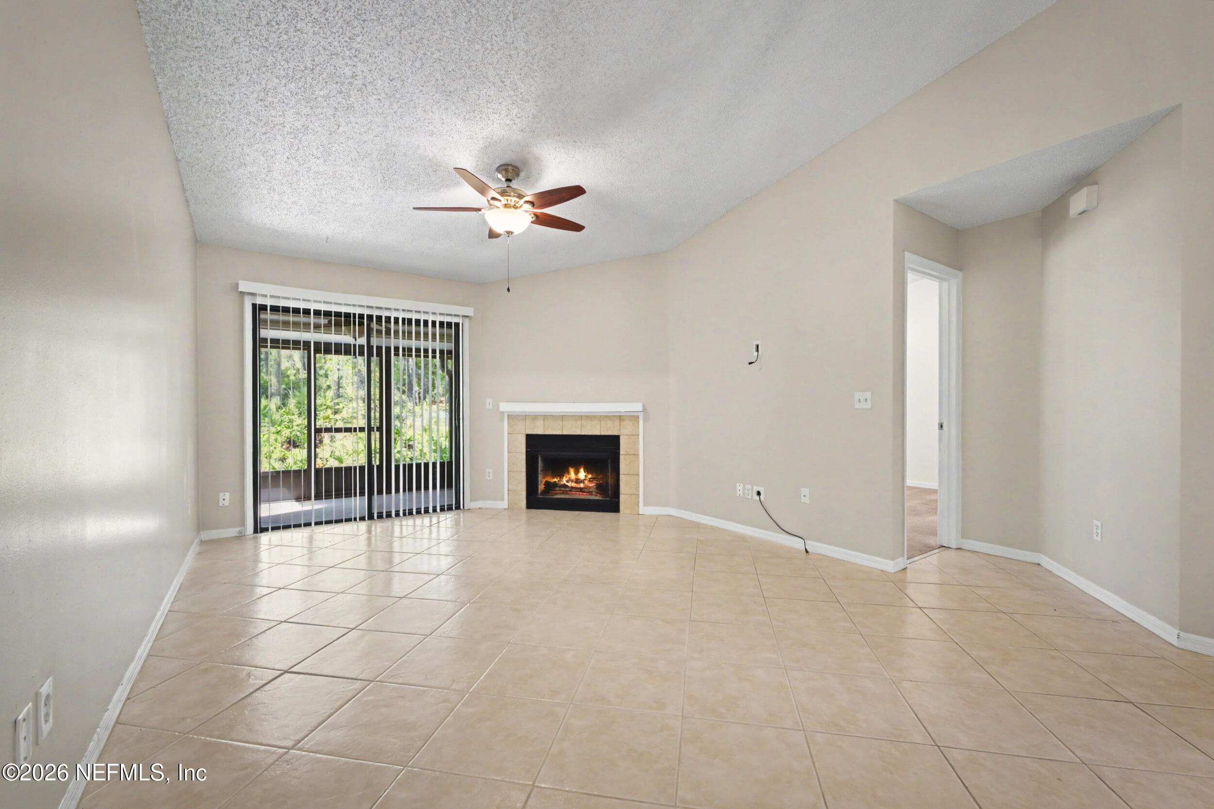 2811 Sea Hawk Drive Ponte Vedra Beach, FL 32082 - Photo 8 of 24 an empty room with windows and fireplace