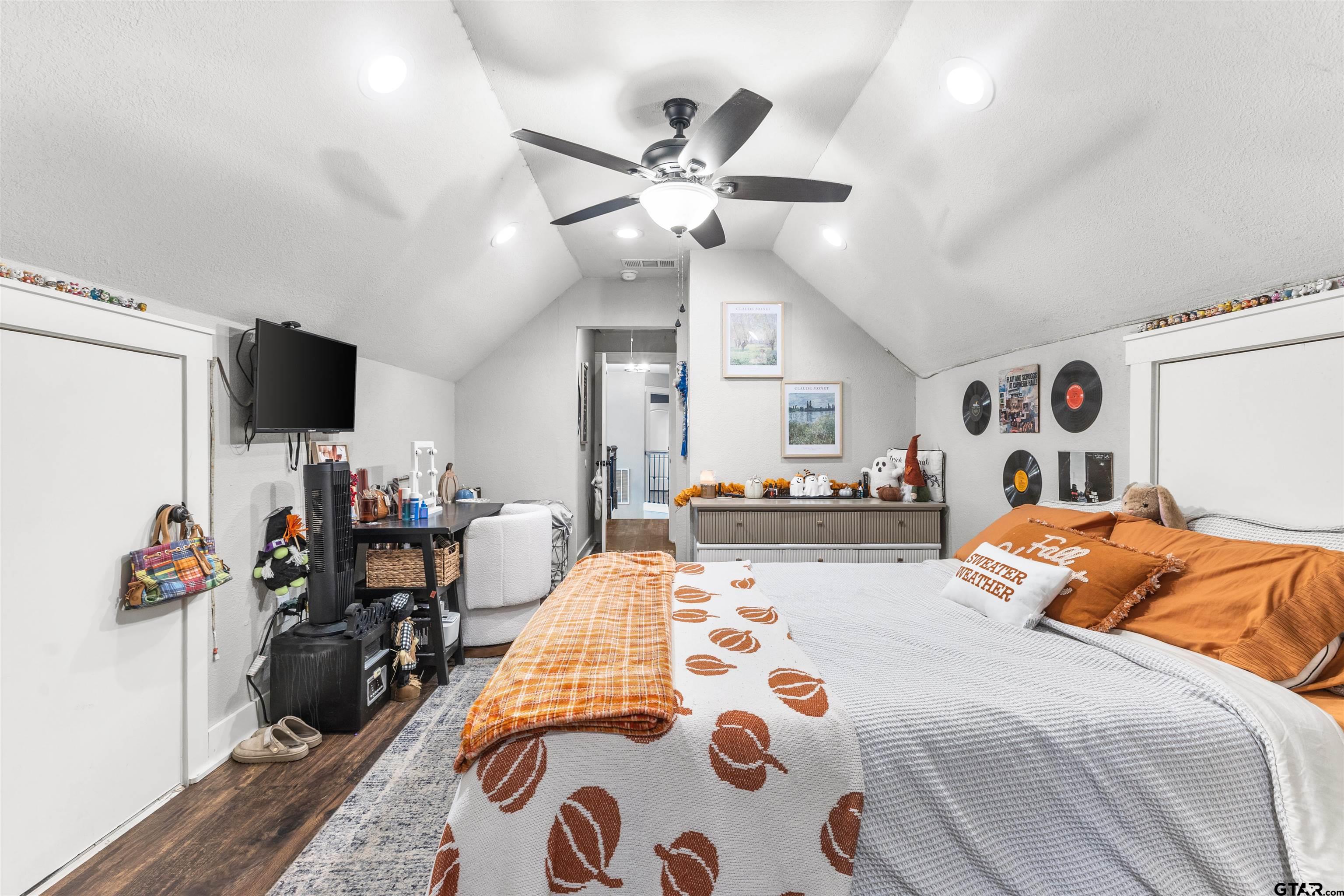 106 Pecan Ridge Mount Vernon, TX 75457 - Photo 21 of 31 a bedroom with furniture a bed and a chandelier