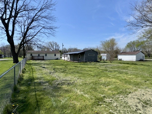 4744 Oxtoby Street Springfield, OH 45505 - Photo 19 of 19 Expansive outdoor space features a well-maintained lawn and sturdy chain-link fencing.