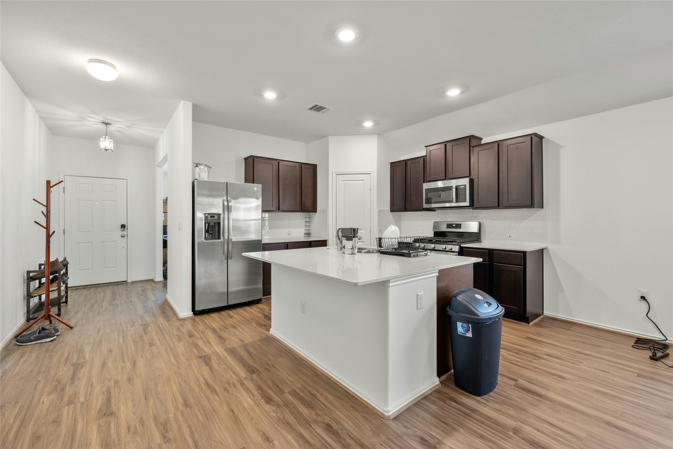 11813 Roscommon Trail Austin, TX 78754 - Photo 11 of 28 a kitchen with stainless steel appliances a refrigerator sink and cabinets