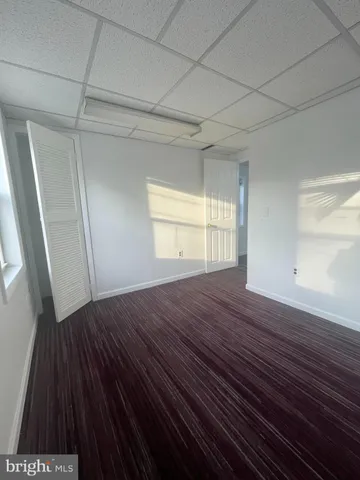 a kitchen with stainless steel appliances a sink a stove and wooden floor