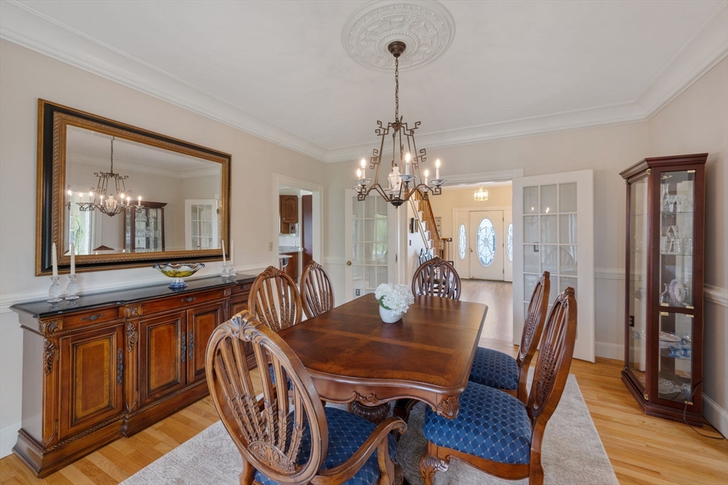 4 Harborview Road Hull, MA 02045 - Photo 12 of 38 a view of a dining room with furniture wooden floor and chandelier