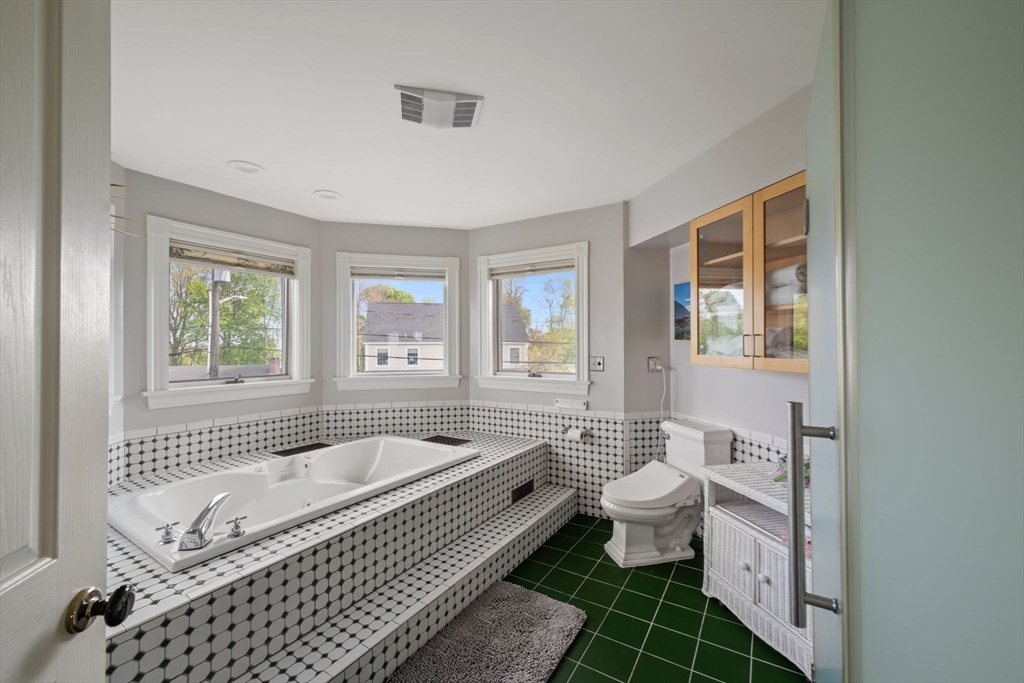 4 Harborview Road Hull, MA 02045 - Photo 19 of 38 a bathroom with a bathtub and a toilet