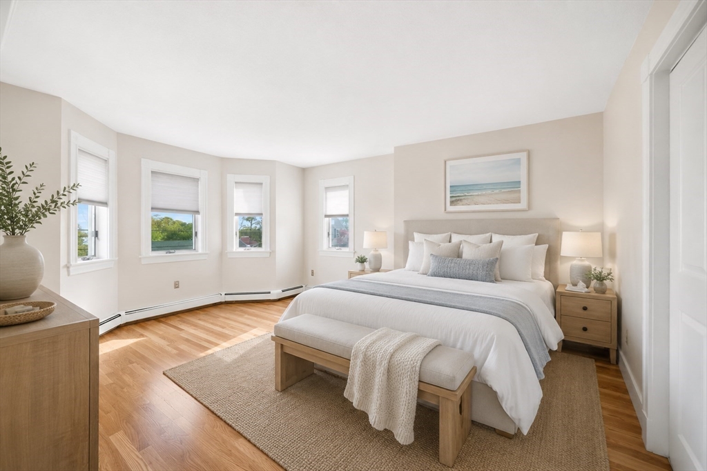 4 Harborview Road Hull, MA 02045 - Photo 20 of 38 a spacious bedroom with a bed and a window