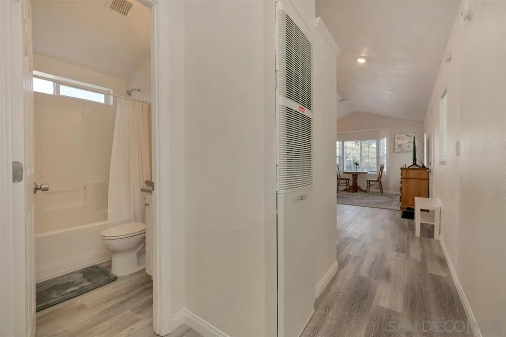 10250 Prospect Avenue, Unit 44 Santee, CA 92071 - Photo 13 of 17 a view of a bathroom with a toilet and a hardwood