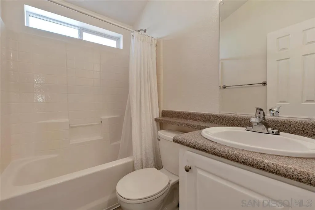 10250 Prospect Avenue, Unit 44 Santee, CA 92071 - Photo 14 of 17 a bathroom with a granite countertop sink toilet and shower