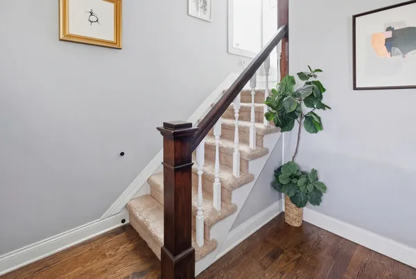 a living room with furniture and a bed
