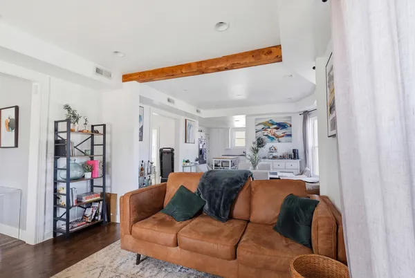 a view of a dining room with furniture and wooden floor