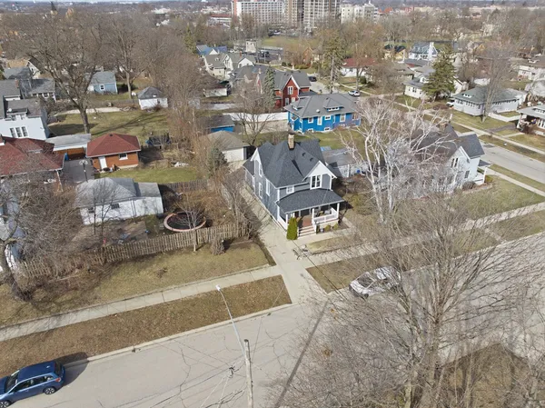 an aerial view of residential building with parking space