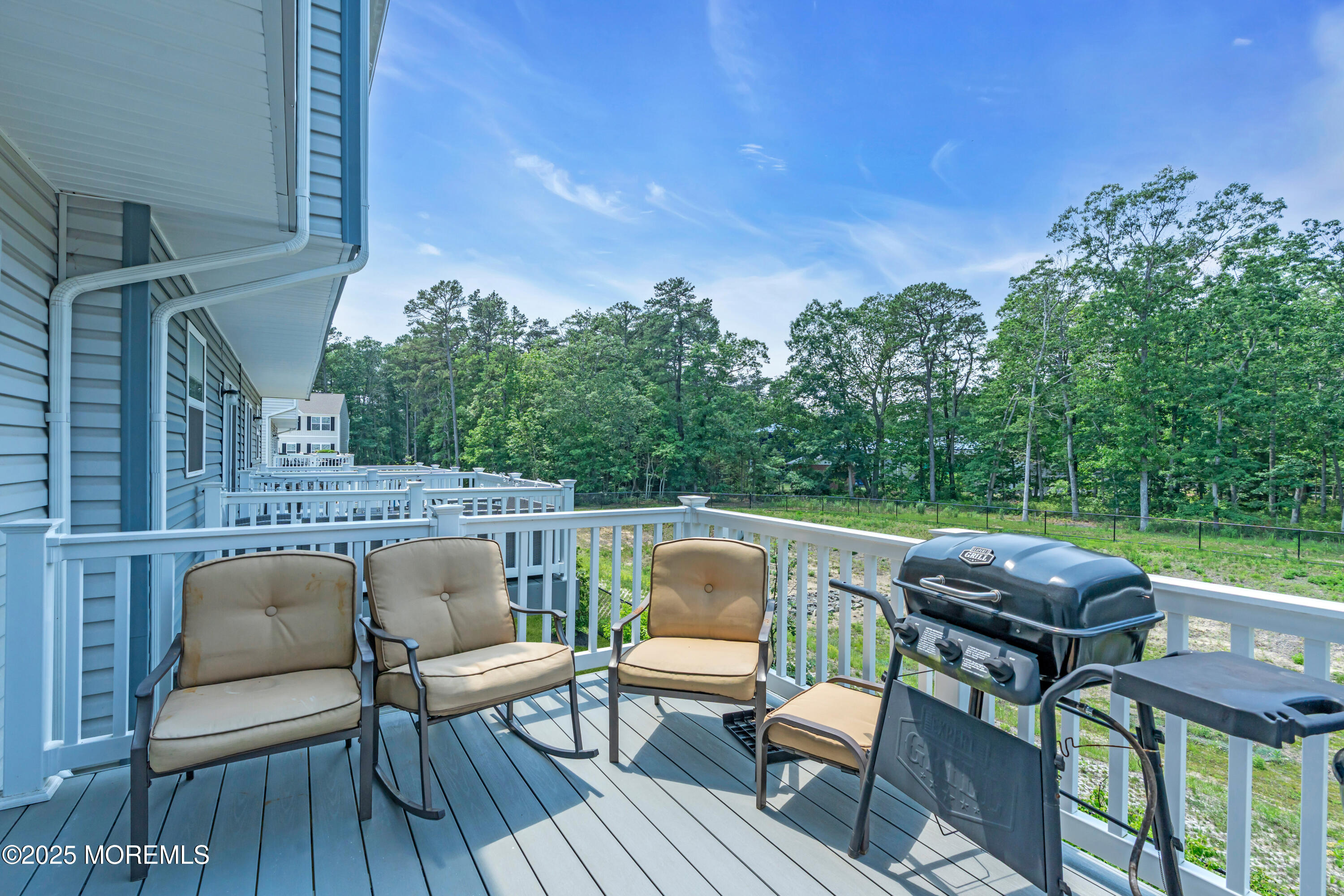 703 Cypress Street Forked River, NJ 08731 - Photo 19 of 50 a balcony with wooden floor and outdoor seating