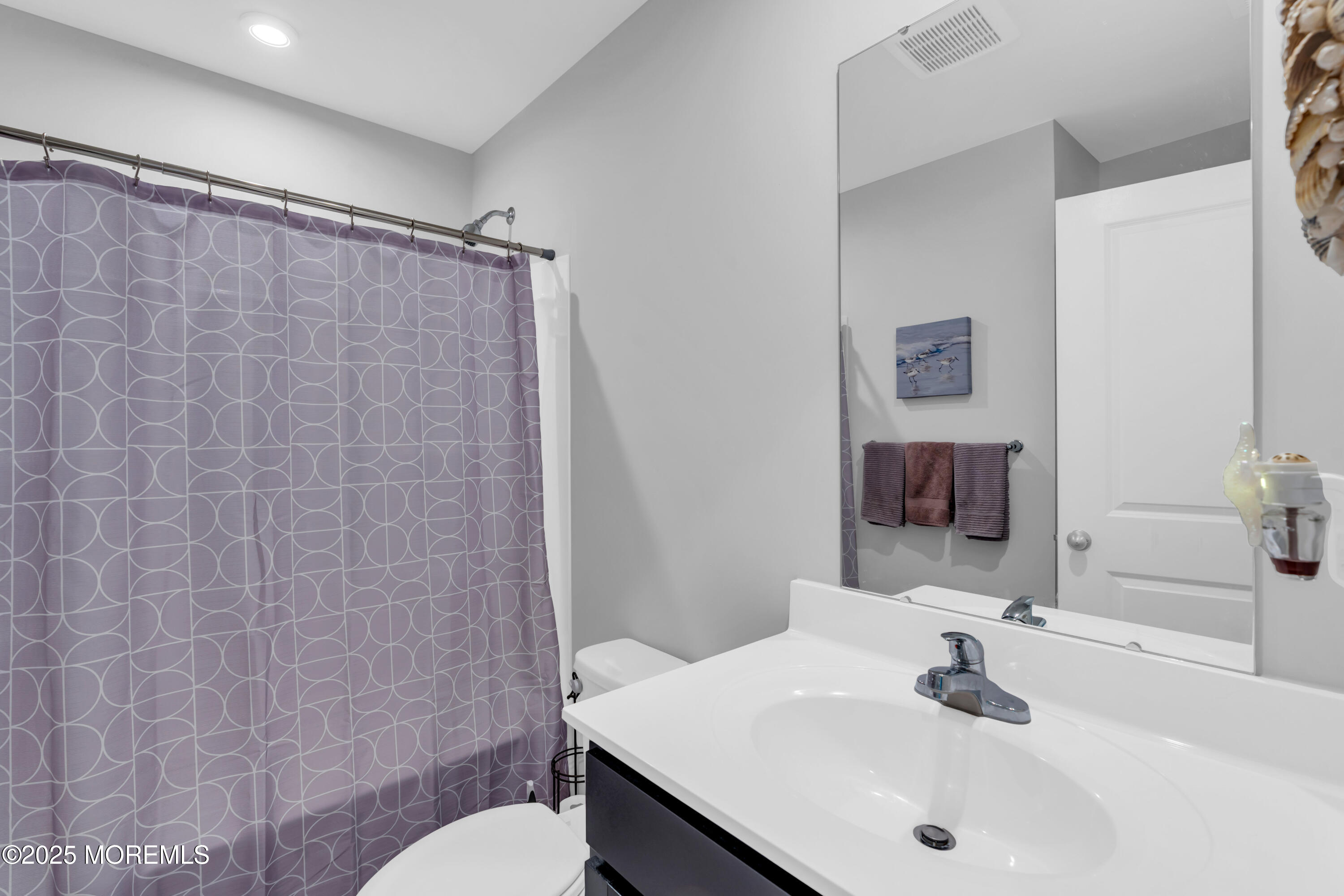 703 Cypress Street Forked River, NJ 08731 - Photo 22 of 50 a bathroom with a sink and a mirror