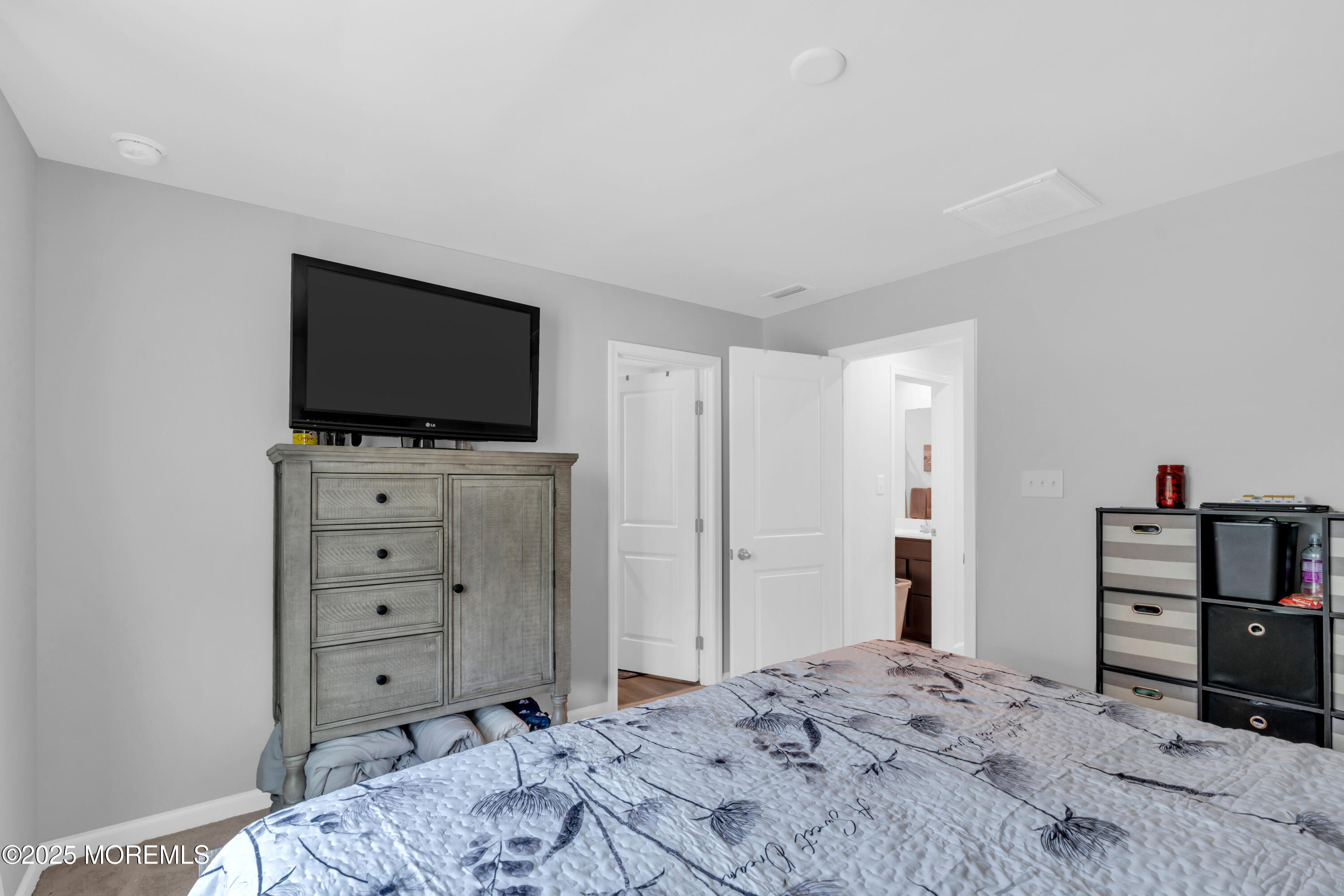 703 Cypress Street Forked River, NJ 08731 - Photo 24 of 50 a bedroom with a bed and a television in it