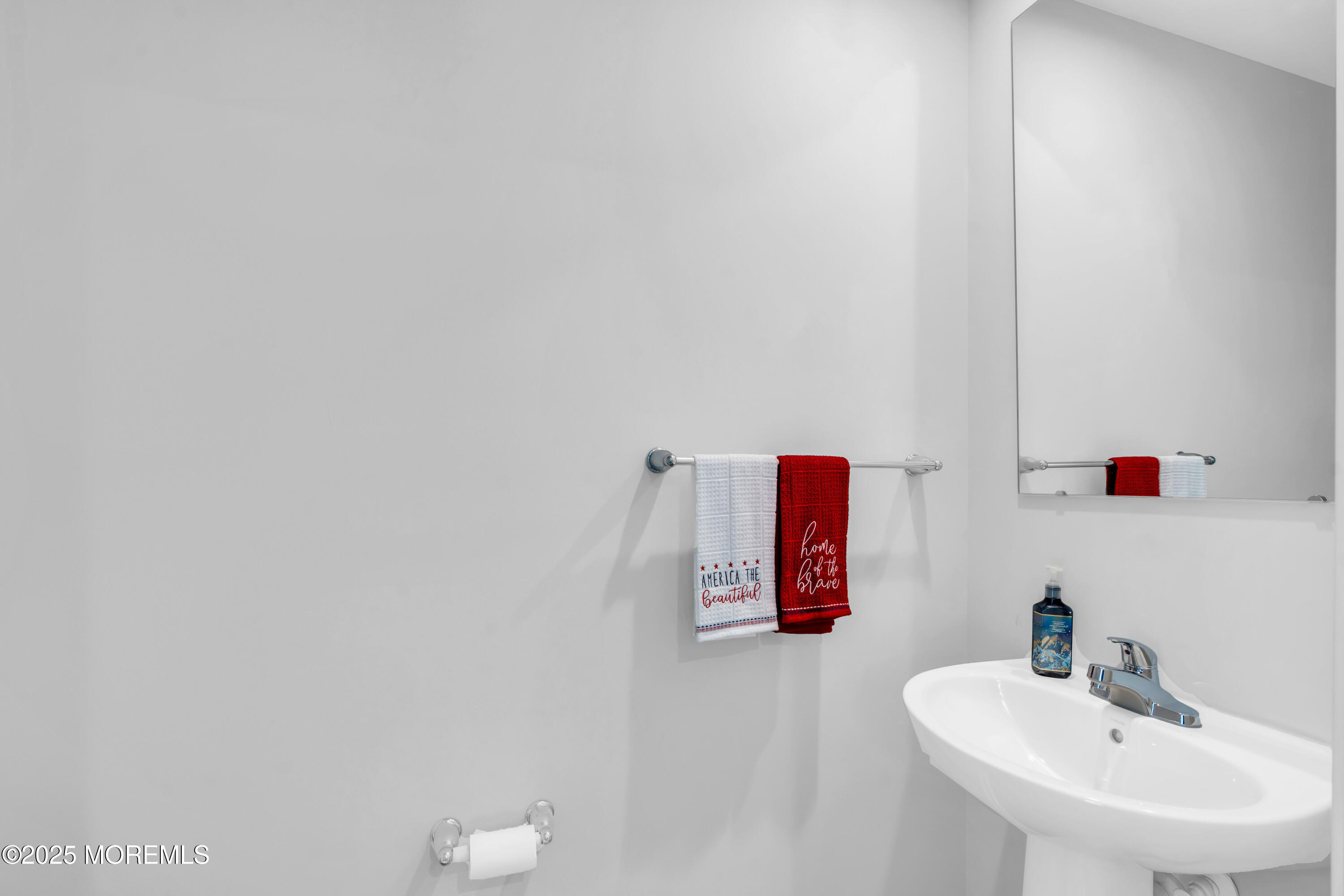 703 Cypress Street Forked River, NJ 08731 - Photo 29 of 50 a bathroom with a sink and a mirror