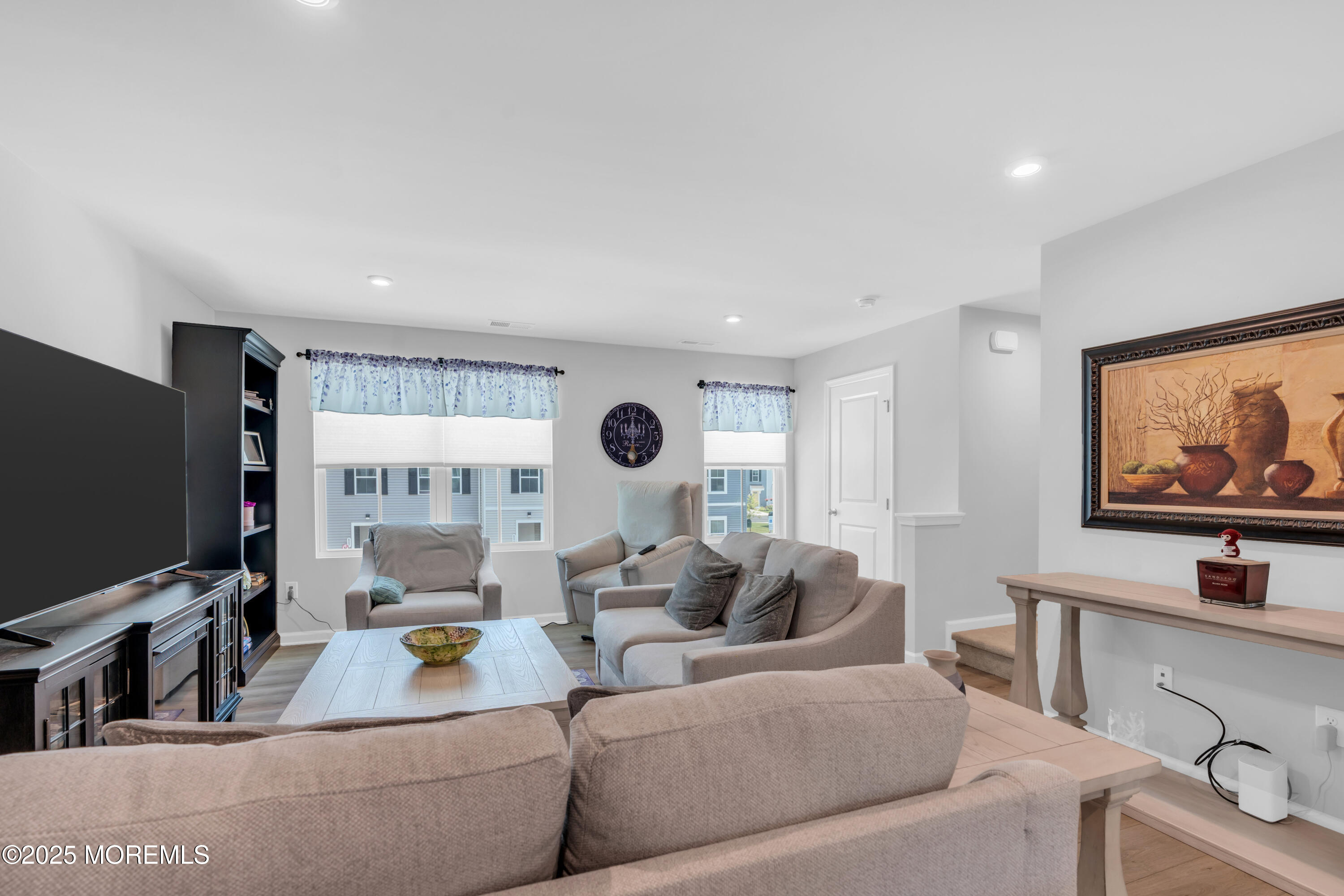 703 Cypress Street Forked River, NJ 08731 - Photo 32 of 50 a living room with furniture and a flat screen tv