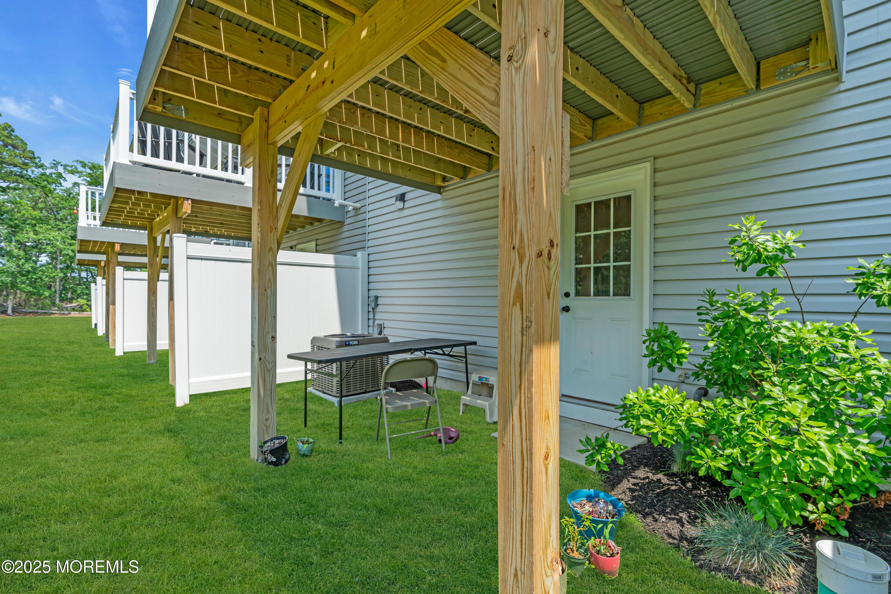 703 Cypress Street Forked River, NJ 08731 - Photo 33 of 50 a view of a chair and table in backyard of the house