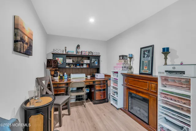 a balcony with wooden floor and outdoor seating