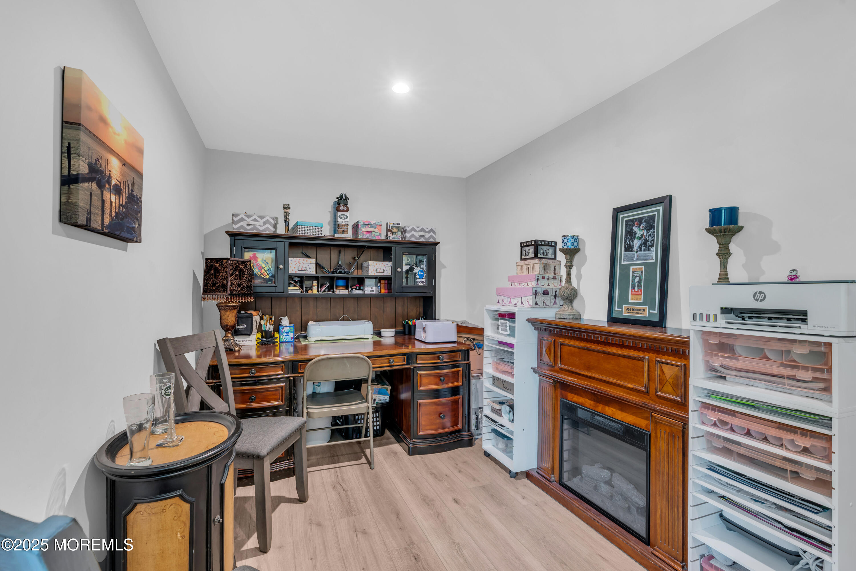 703 Cypress Street Forked River, NJ 08731 - Photo 43 of 50 a view of a workspace with furniture and wooden floor