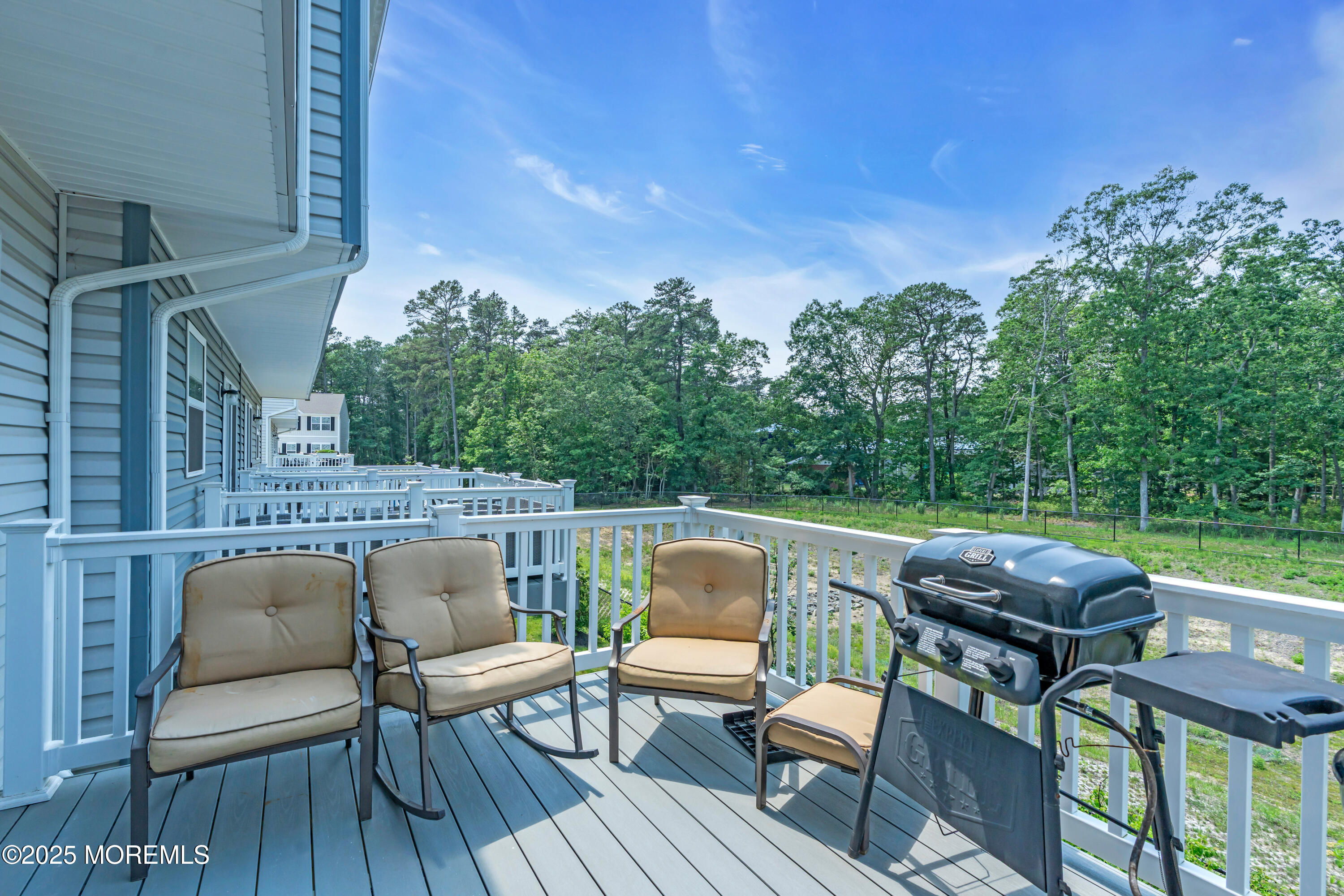 703 Cypress Street Forked River, NJ 08731 - Photo 46 of 50 a balcony with wooden floor and outdoor seating