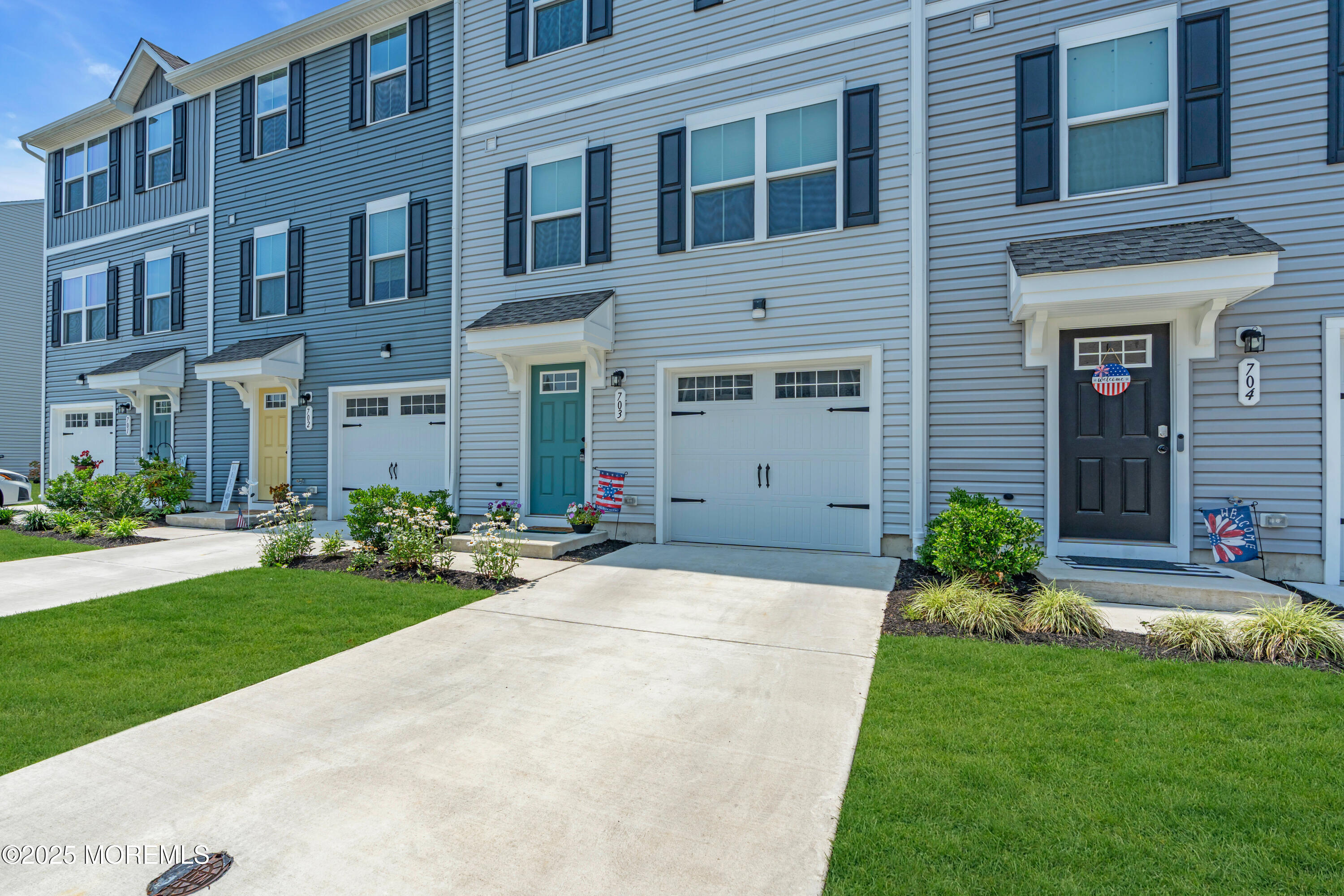 703 Cypress Street Forked River, NJ 08731 - Photo 5 of 50 a front view of a house with yard and green space